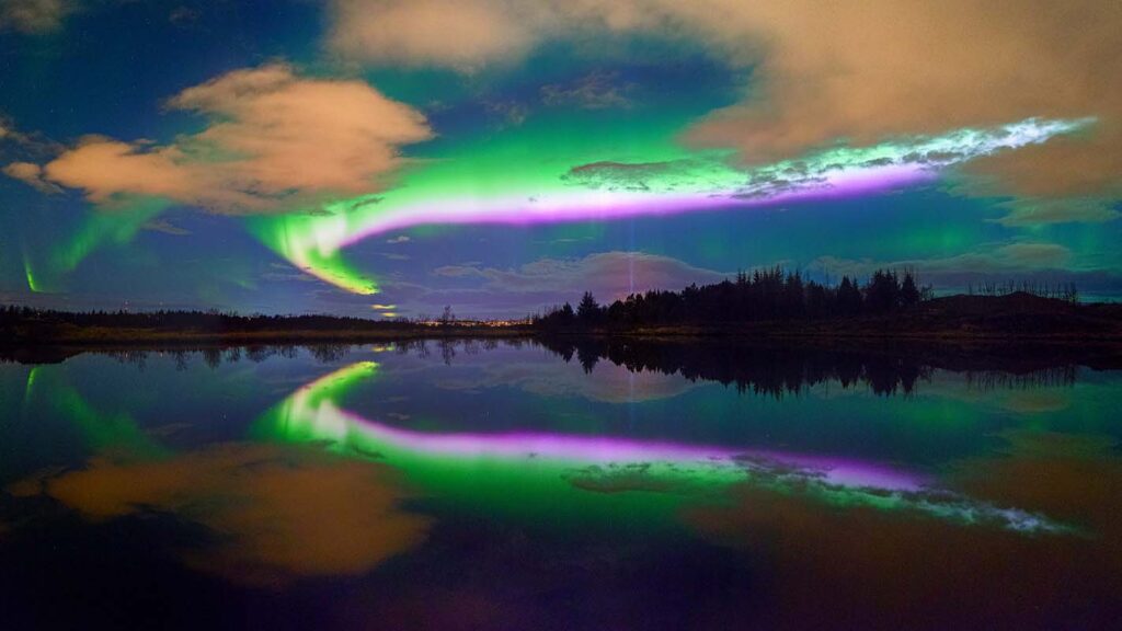 Aurora reflections over Thingvellir Lake in Iceland