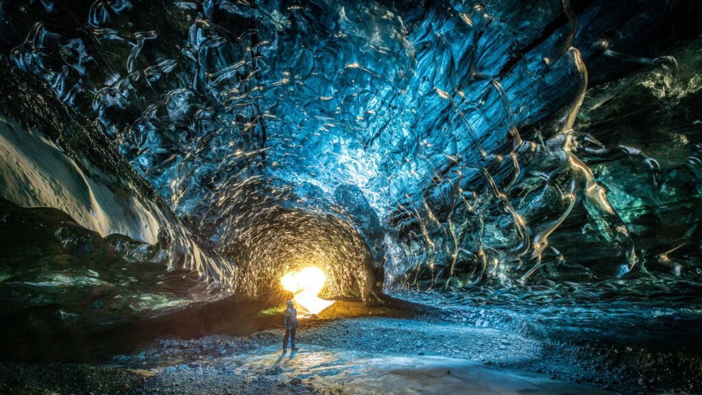 Man standing inside an Ice Cave in Iceland